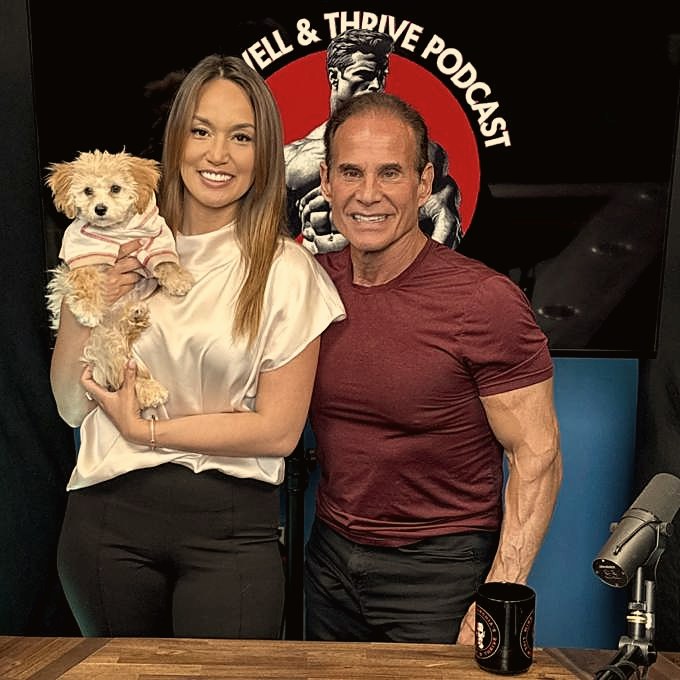 Mike Torchia with a guest and her puppy on the podcast set