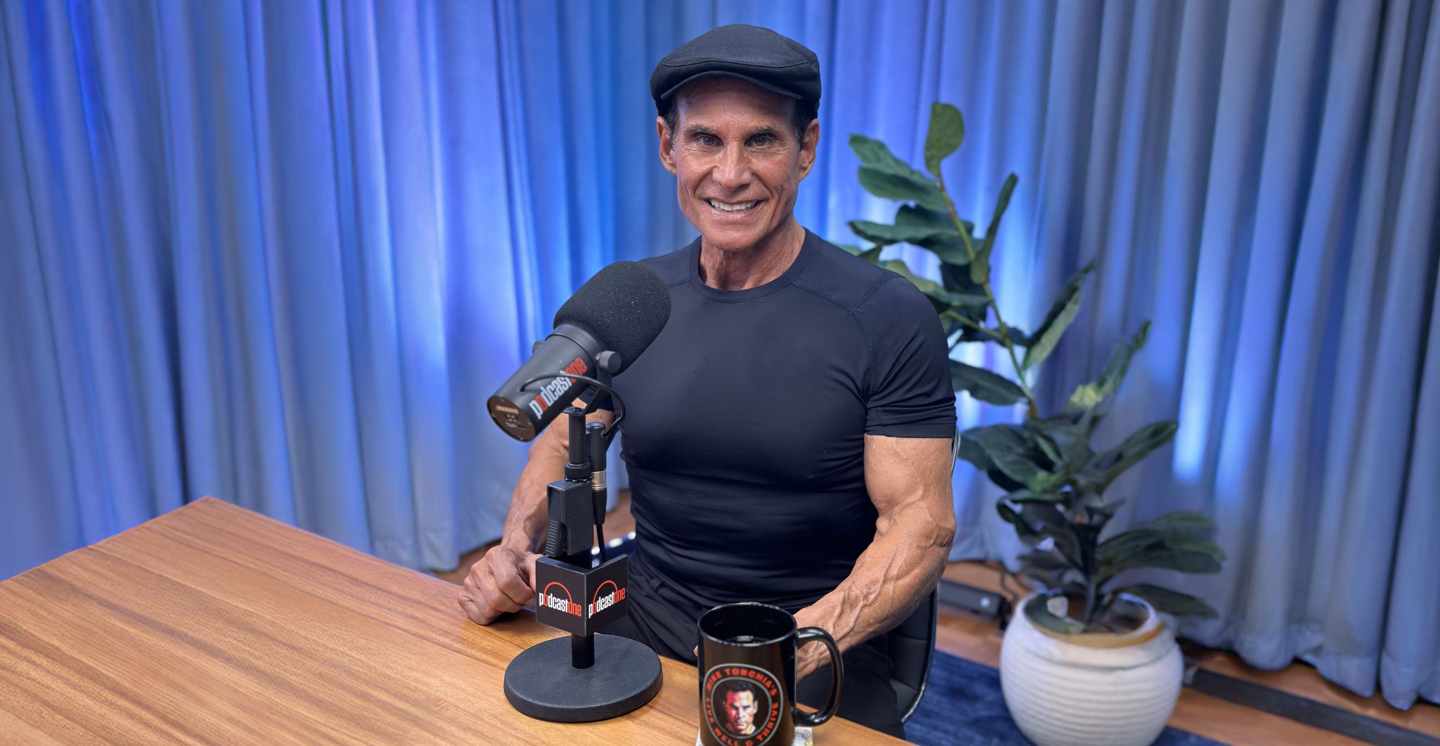 Mike Torchia at the microphone on the PodcastOne set
